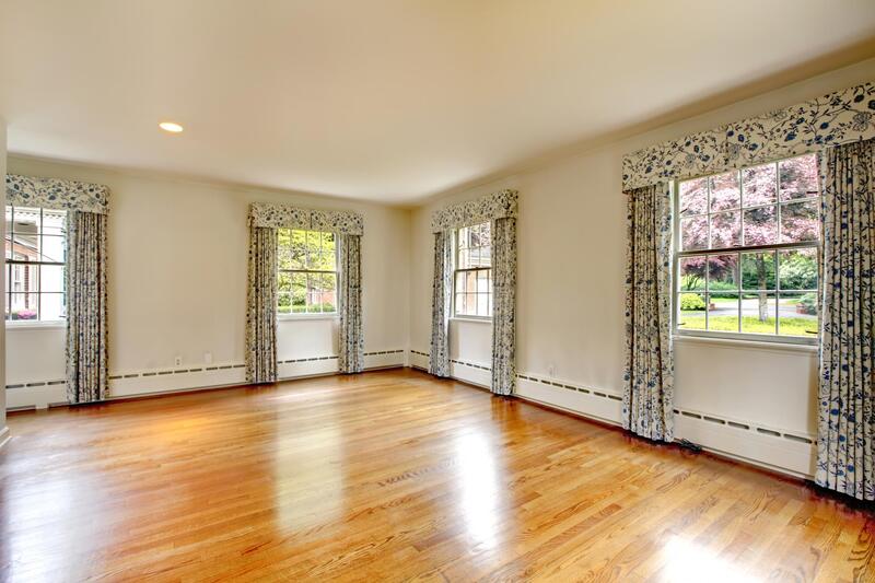 spacious room with wood floor